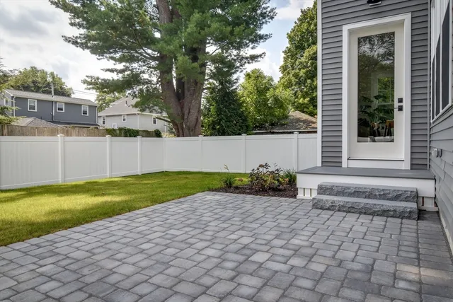 a view of backyard with trampoline