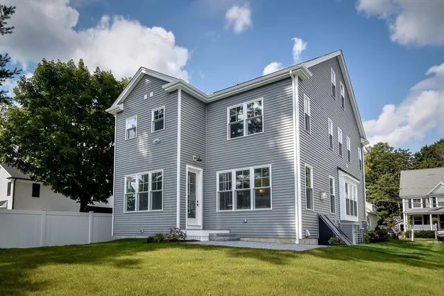a house view with swimming pool and garden space