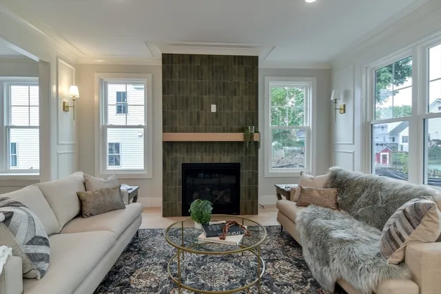 a living room with furniture and a fireplace