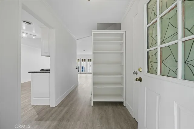 a view of walk in closet with empty racks