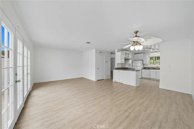 a view of a kitchen with furniture and a chandelier