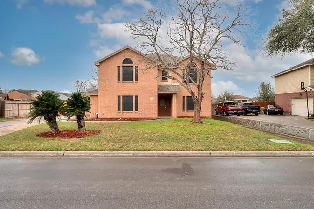 a bathroom with a sink and cars parked in front of it
