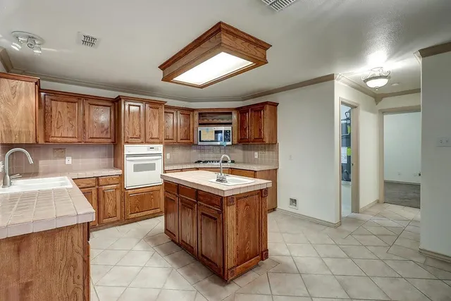 a kitchen with a stove and a sink