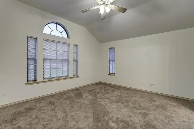 an empty room with a view of a livingroom