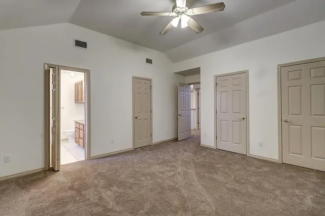 an empty room with closet area