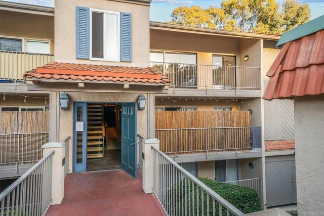 a view of a house with wooden deck