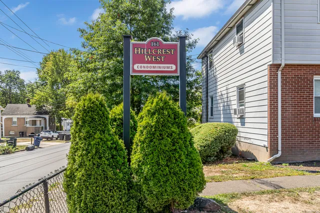 a sign that is on a brick wall