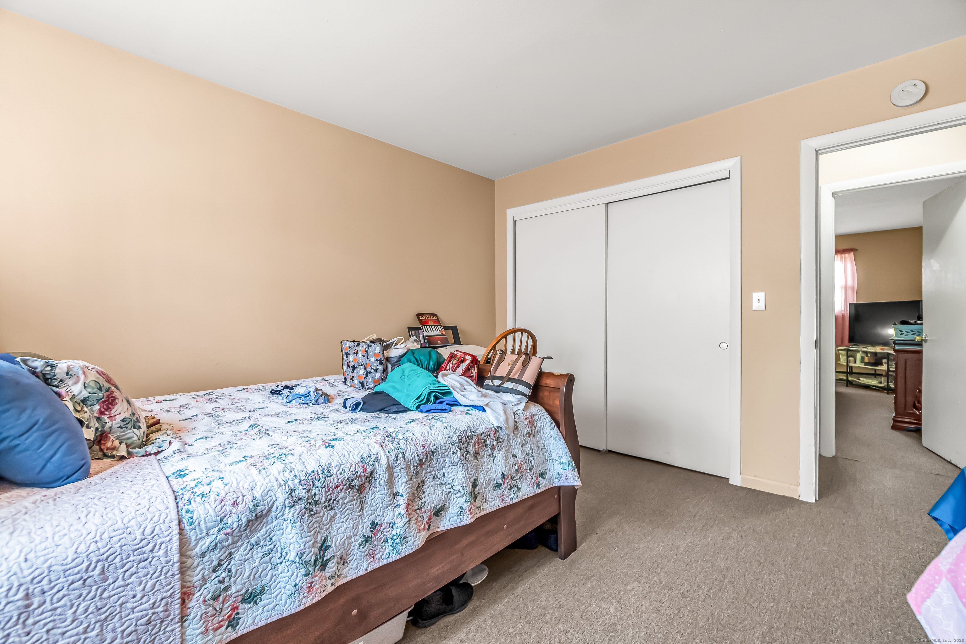 161 West Spring Street, Unit C1 West Haven, CT 06516 - Photo 12 of 14 a bedroom with a bed and a closet