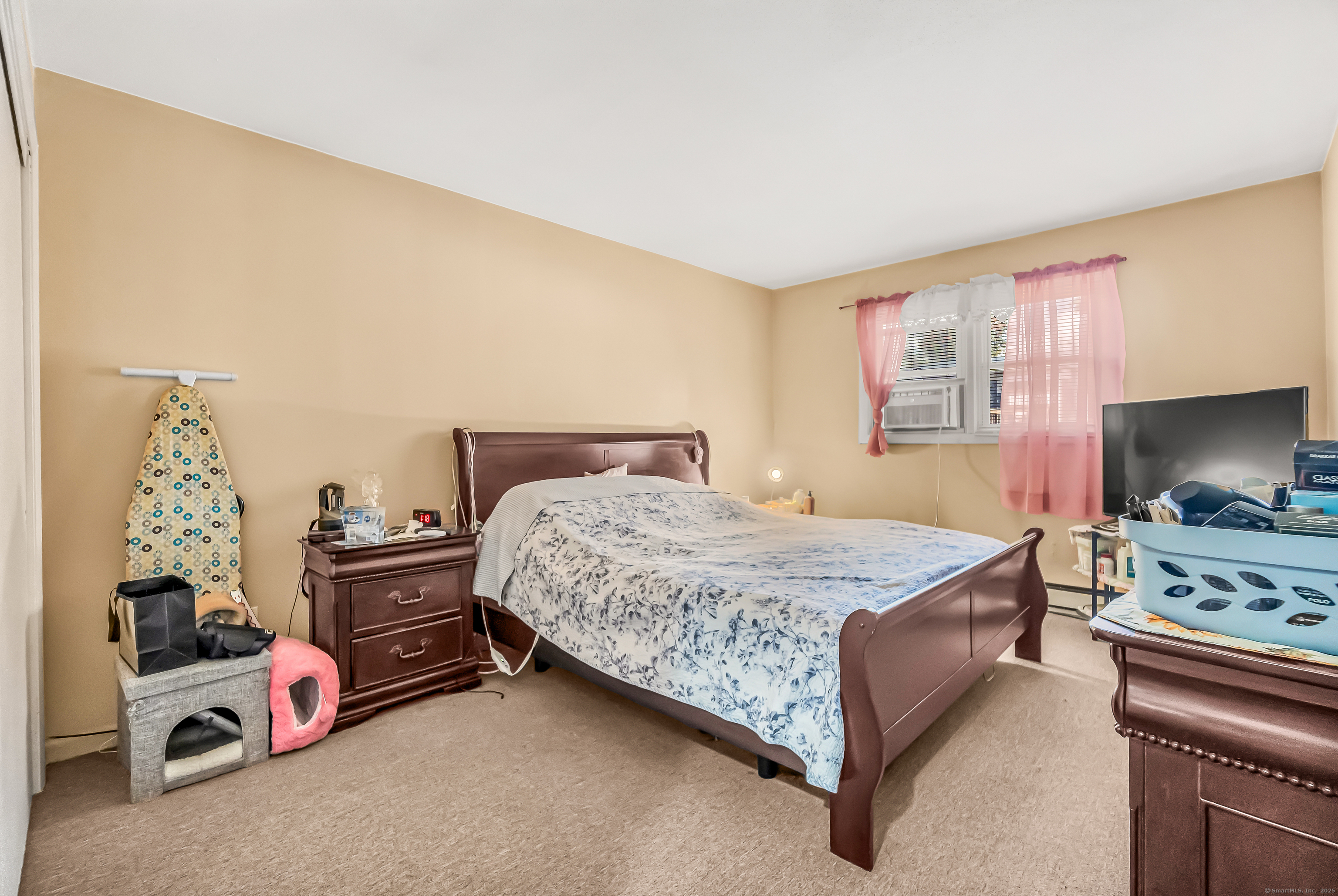 161 West Spring Street, Unit C1 West Haven, CT 06516 - Photo 13 of 14 a bedroom with a bed and a dresser