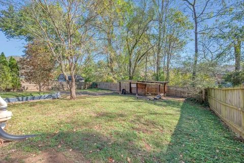 a backyard of a house with lots of green space