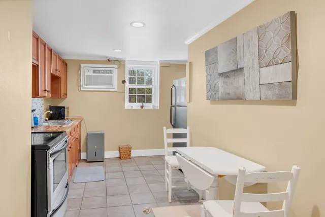 a kitchen with a stove a sink and a refrigerator