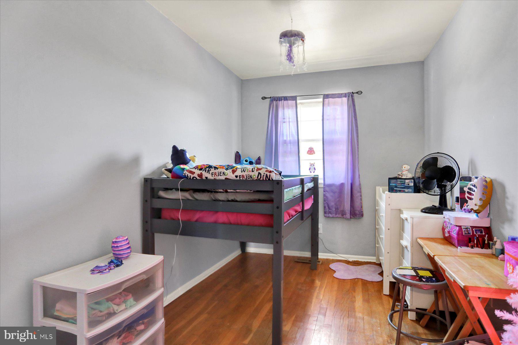 959 Elm Road Baltimore, MD 21227 - Photo 11 of 27 a living room with furniture and a wooden floor