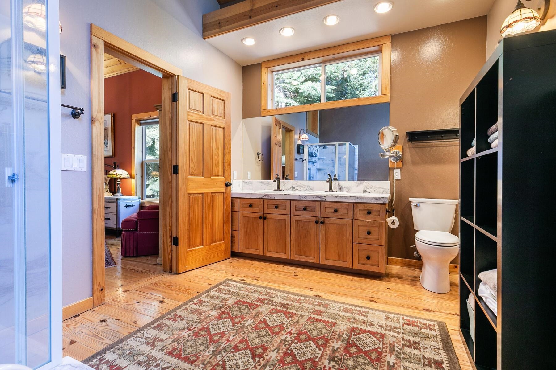 11325 Thelin Drive Truckee, CA 96161 - Photo 11 of 21 a bathroom with a sink mirror and a shower