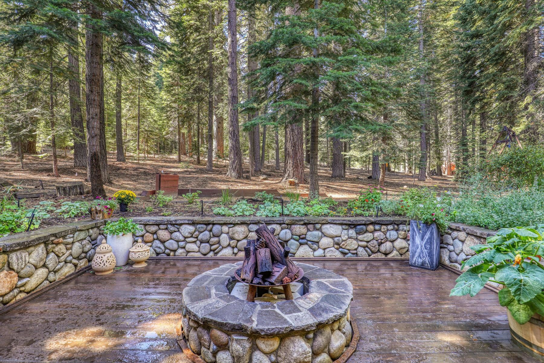11325 Thelin Drive Truckee, CA 96161 - Photo 16 of 21 a view of a fountain in the yard with large trees