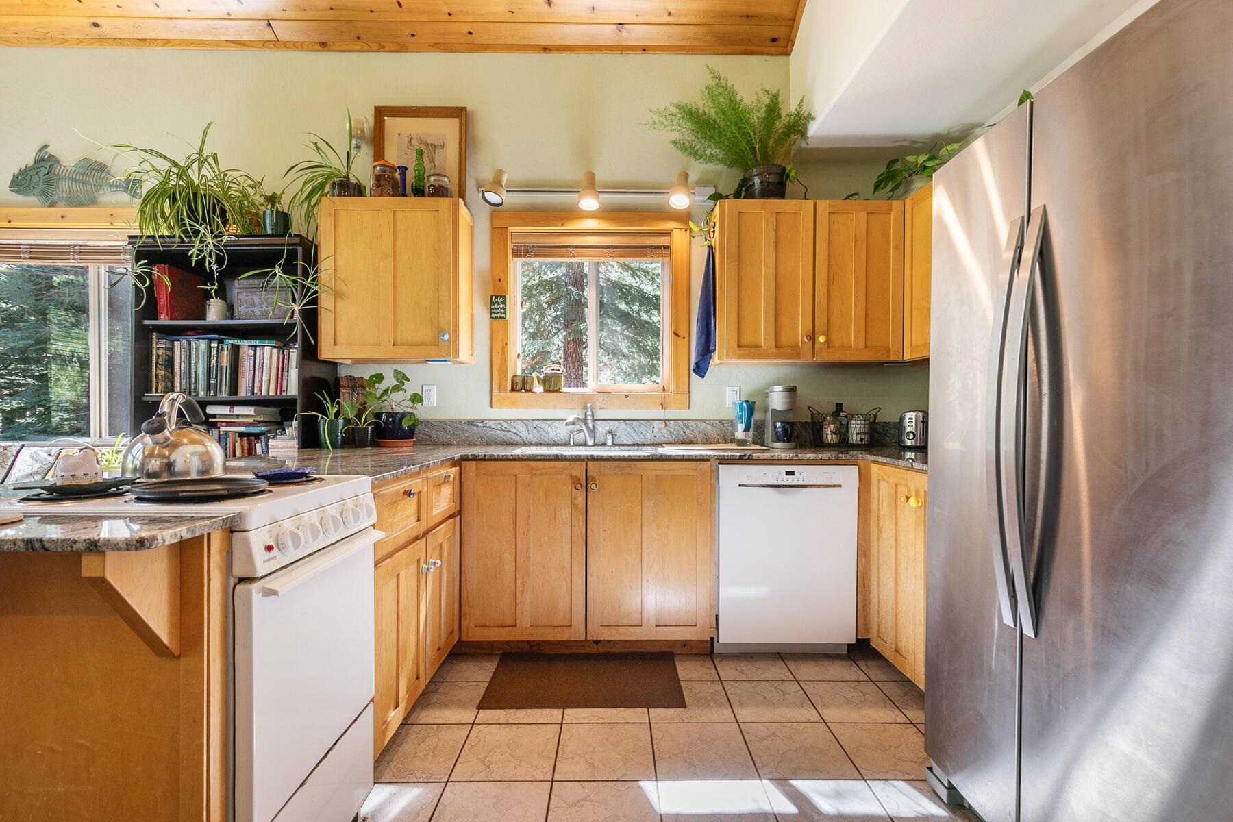 11325 Thelin Drive Truckee, CA 96161 - Photo 21 of 21 a kitchen with stainless steel appliances a refrigerator sink and cabinets