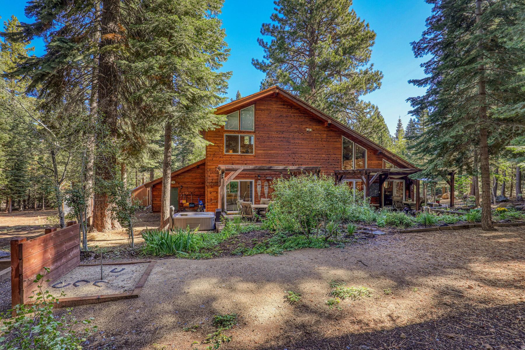 11325 Thelin Drive Truckee, CA 96161 - Photo 3 of 21 a front view of a house with a yard and trees