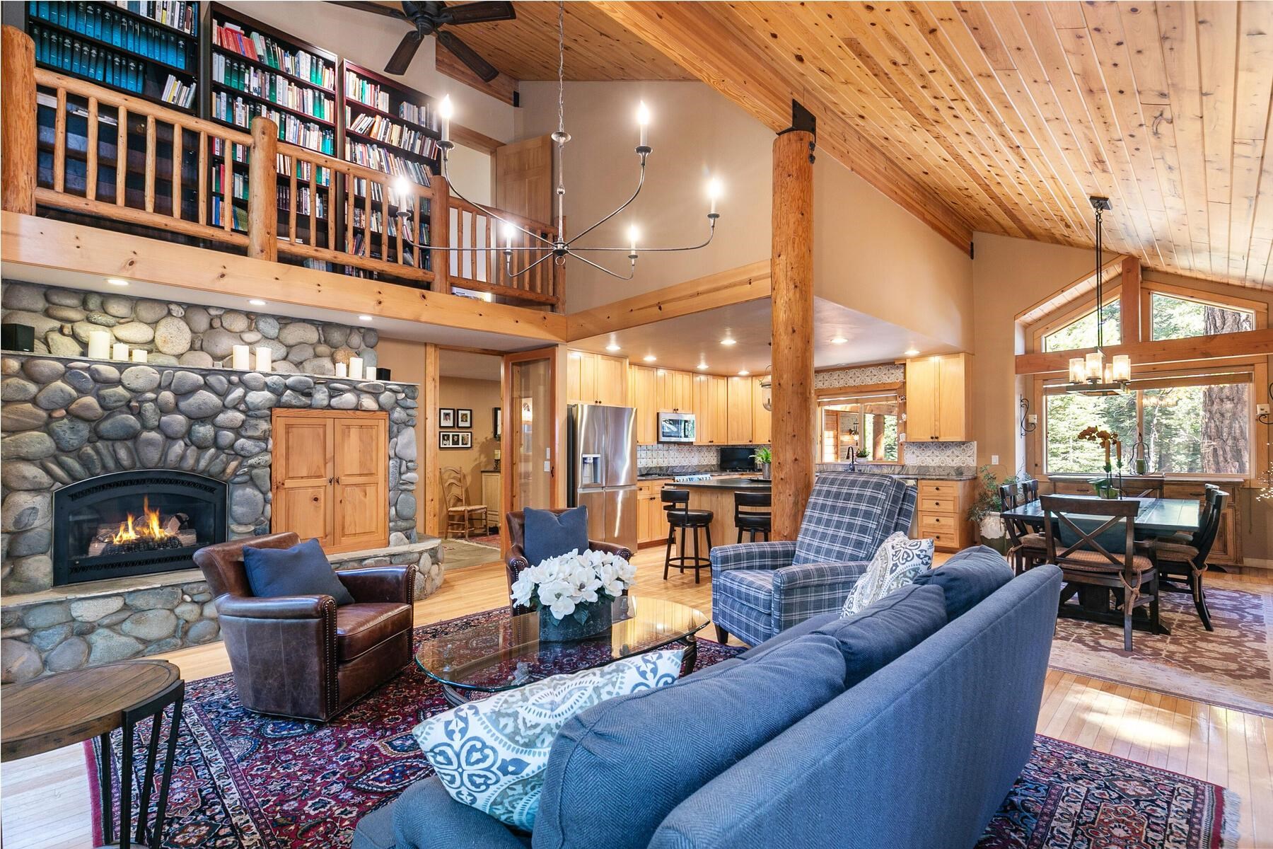 11325 Thelin Drive Truckee, CA 96161 - Photo 7 of 21 a living room with fireplace furniture and a floor to ceiling window