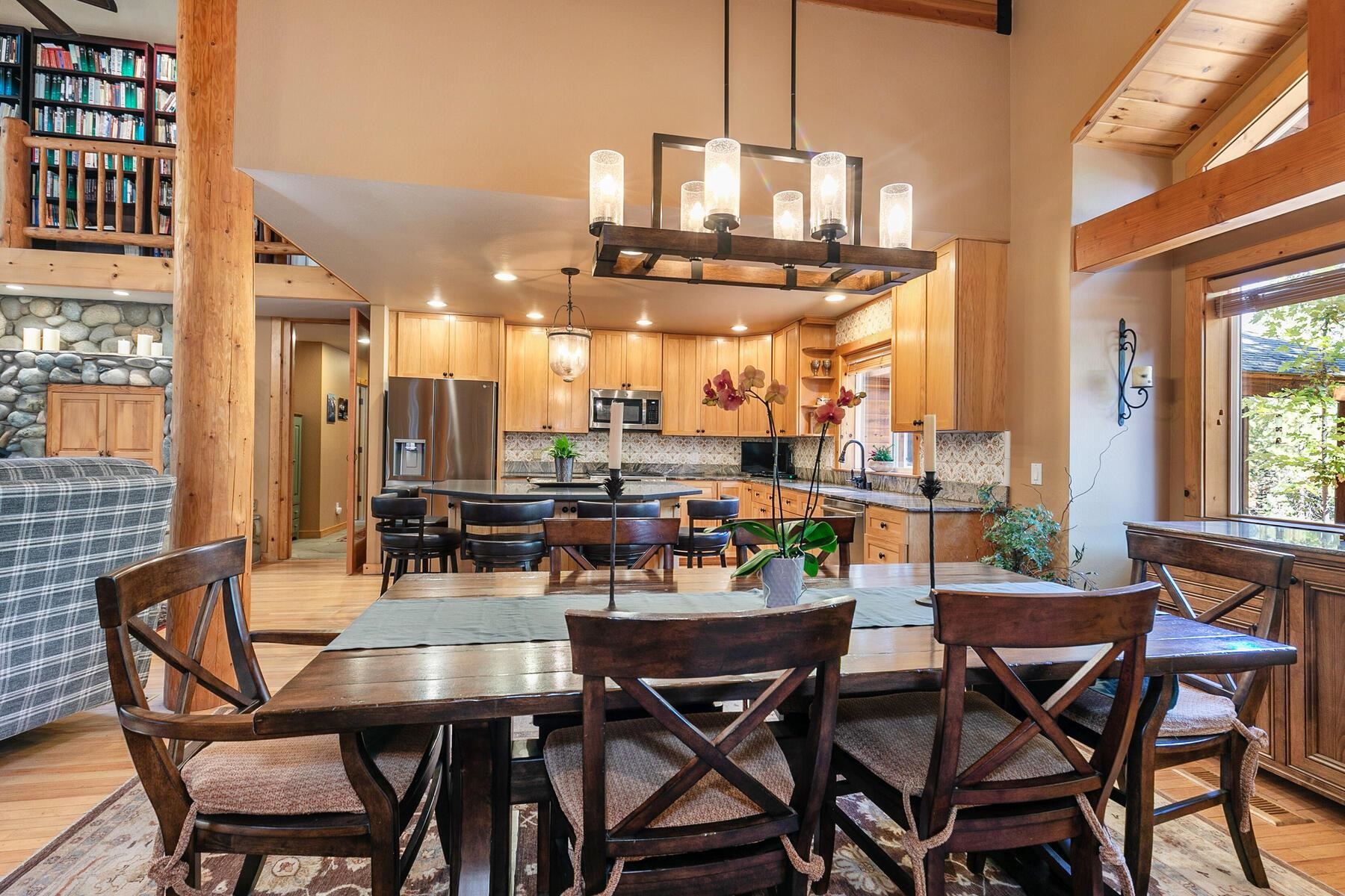 11325 Thelin Drive Truckee, CA 96161 - Photo 8 of 21 a view of a dining room with furniture and a chandelier