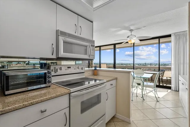 a bedroom with double bed and a chandelier