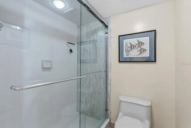 a view of a room with furniture and floor to ceiling window