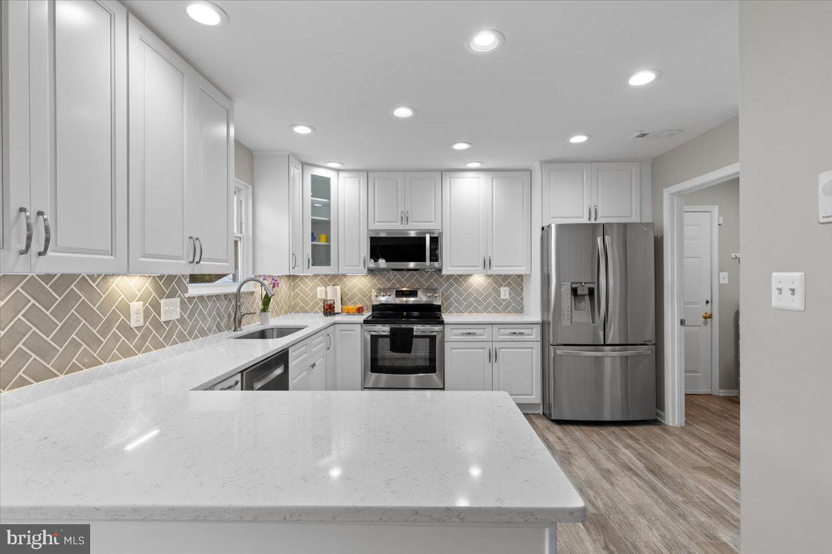 1587 Kingstream Circle Herndon, VA 20170 - Photo 20 of 65 Recessed lighting and LVP flooring