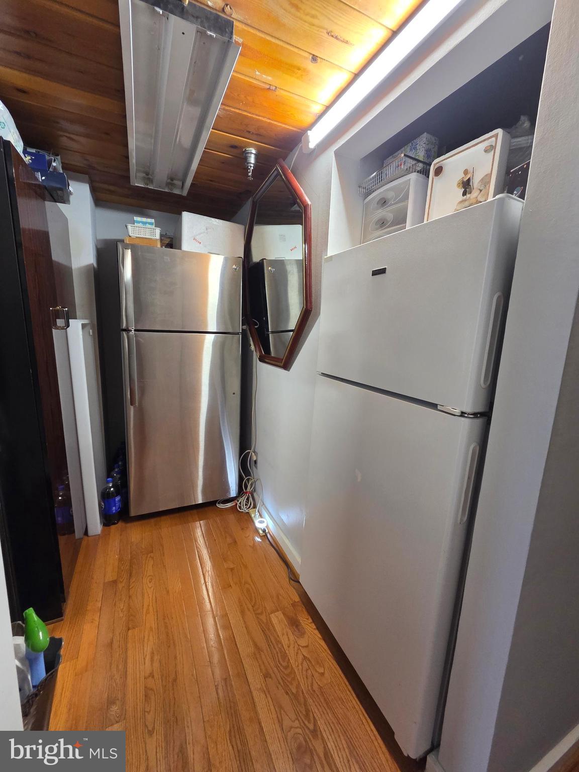 1010 Race Street, Unit 6LM Philadelphia, PA 19107 - Photo 12 of 25 a view of a refrigerator in kitchen and an empty room