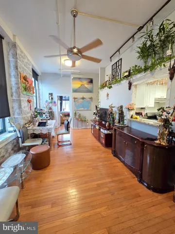a living room with lots of furniture and kitchen view