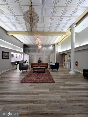 a large room with lots of furniture and natural light