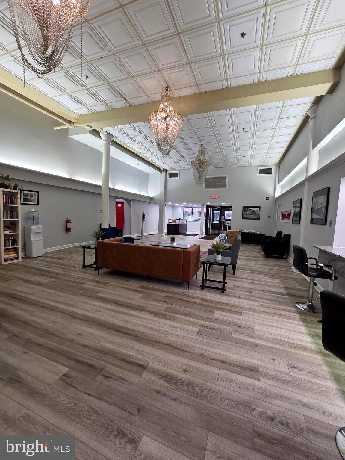 1010 Race Street, Unit 6LM Philadelphia, PA 19107 - Photo 7 of 25 a living room with furniture and a wooden floor
