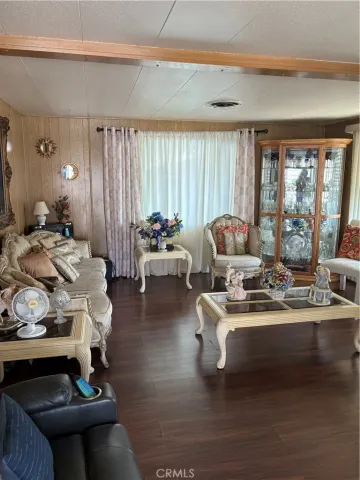 a living room with furniture and large windows