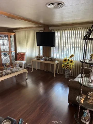 a living room with furniture window and wooden floor