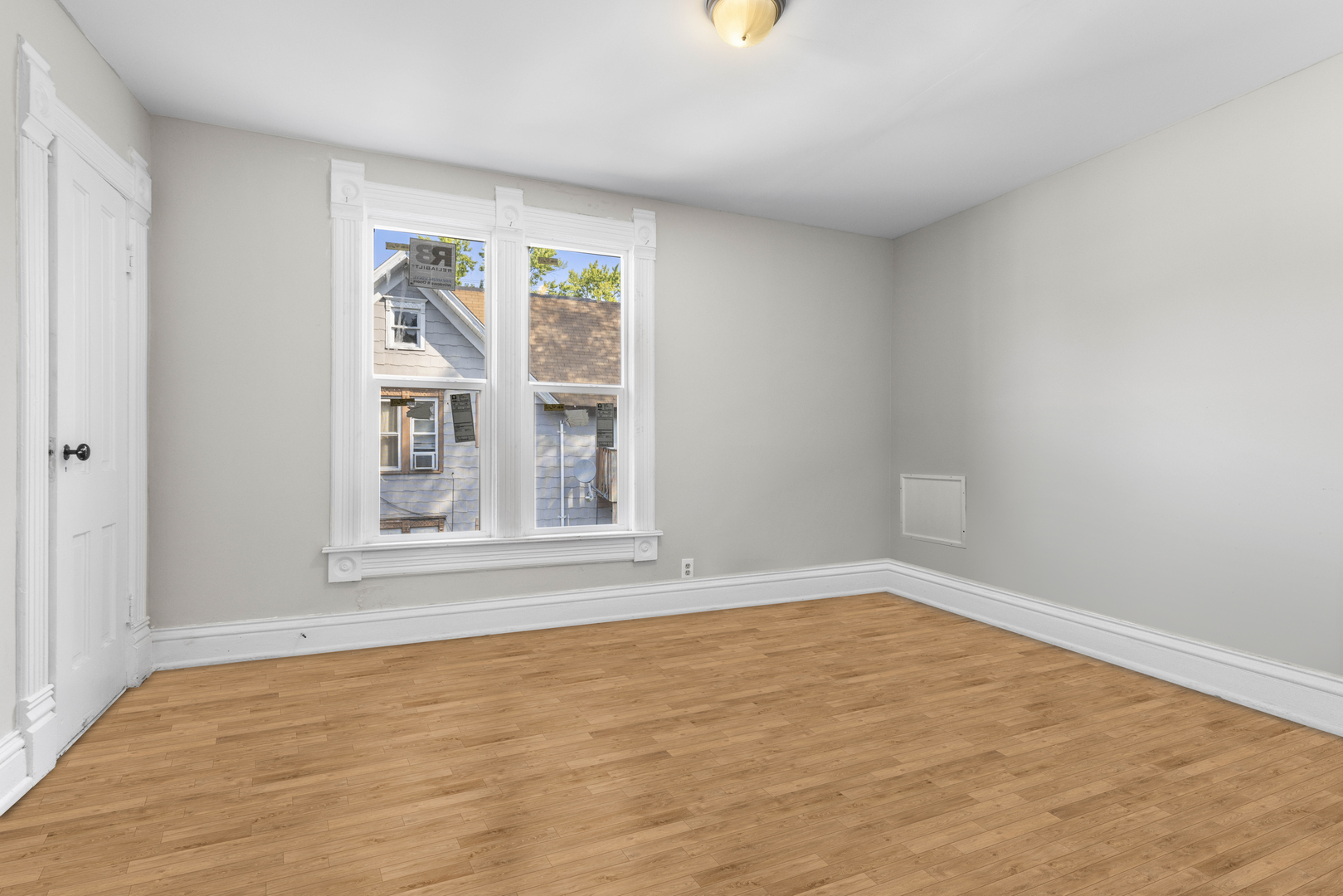 1710 7th Street Rockford, IL 61104 - Photo 3 of 13 an empty room with windows
