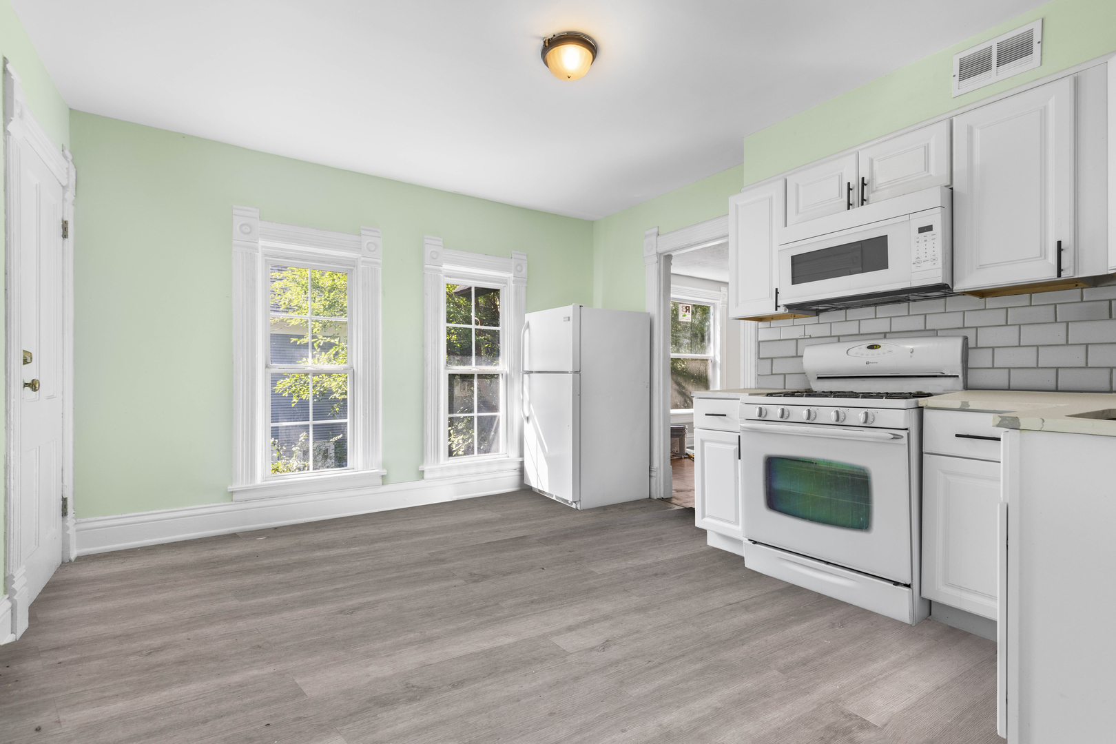 1710 7th Street Rockford, IL 61104 - Photo 6 of 13 a view of a kitchen with stove and cabinets