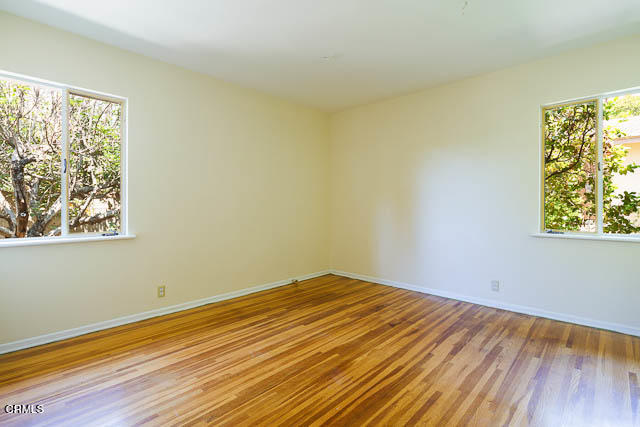 3665 Shadow Grove Road Pasadena, CA 91107 - Photo 17 of 27 a view of empty room with wooden floor and fan