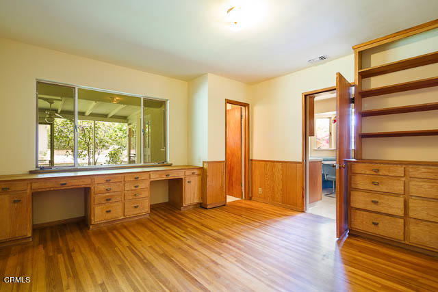 3665 Shadow Grove Road Pasadena, CA 91107 - Photo 21 of 27 a large space with a window and wooden floor