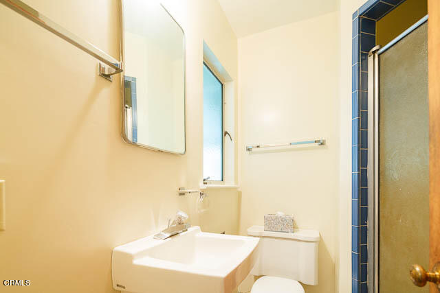 3665 Shadow Grove Road Pasadena, CA 91107 - Photo 22 of 27 a bathroom with a sink and a mirror