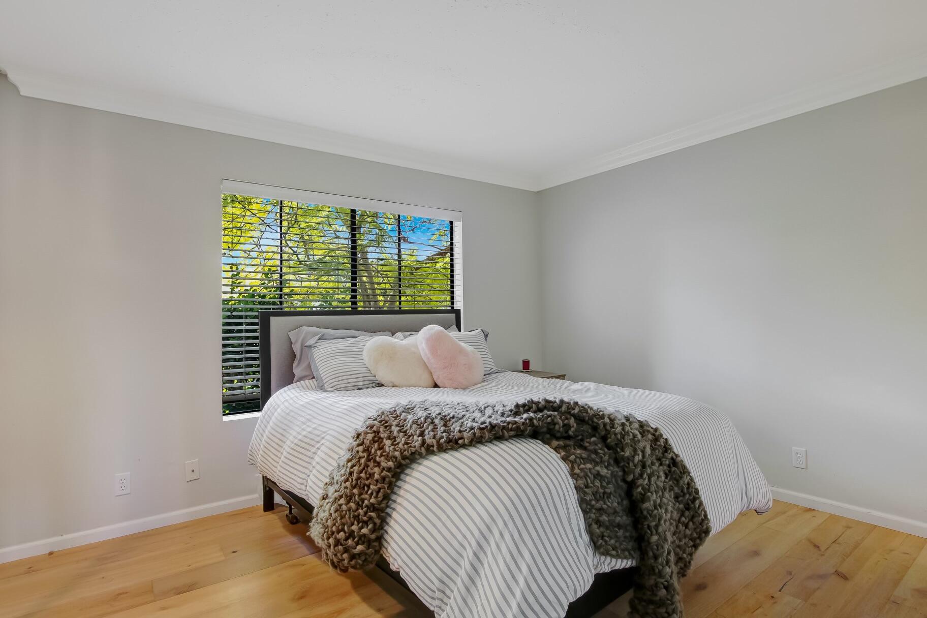 3375 Foothill Road, Unit 824 Carpinteria, CA 93013 - Photo 20 of 29 a bed sitting in a bedroom next to a window