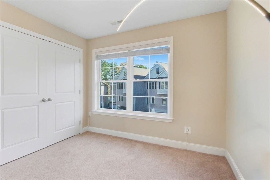 66 Compass Point, Unit 66 North Andover, MA 01845 - Photo 41 of 42 an empty room with a window