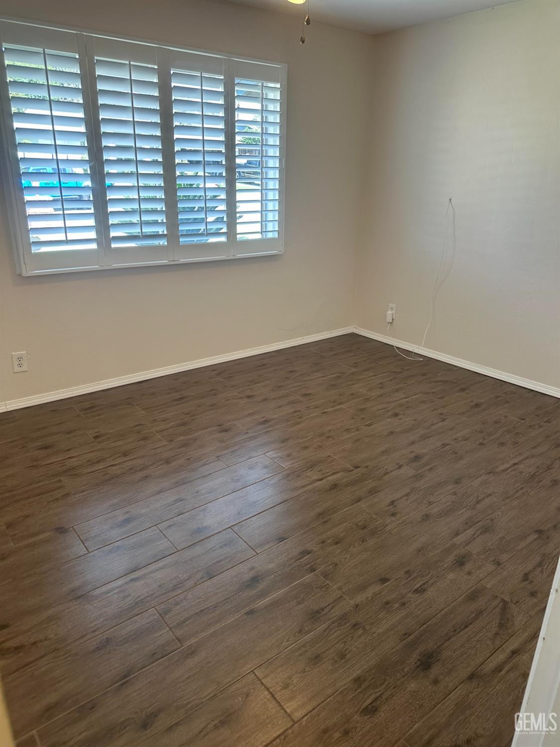 Undisclosed Address Bakersfield, CA 93306 - Photo 15 of 27 wooden floor in an empty room with a window