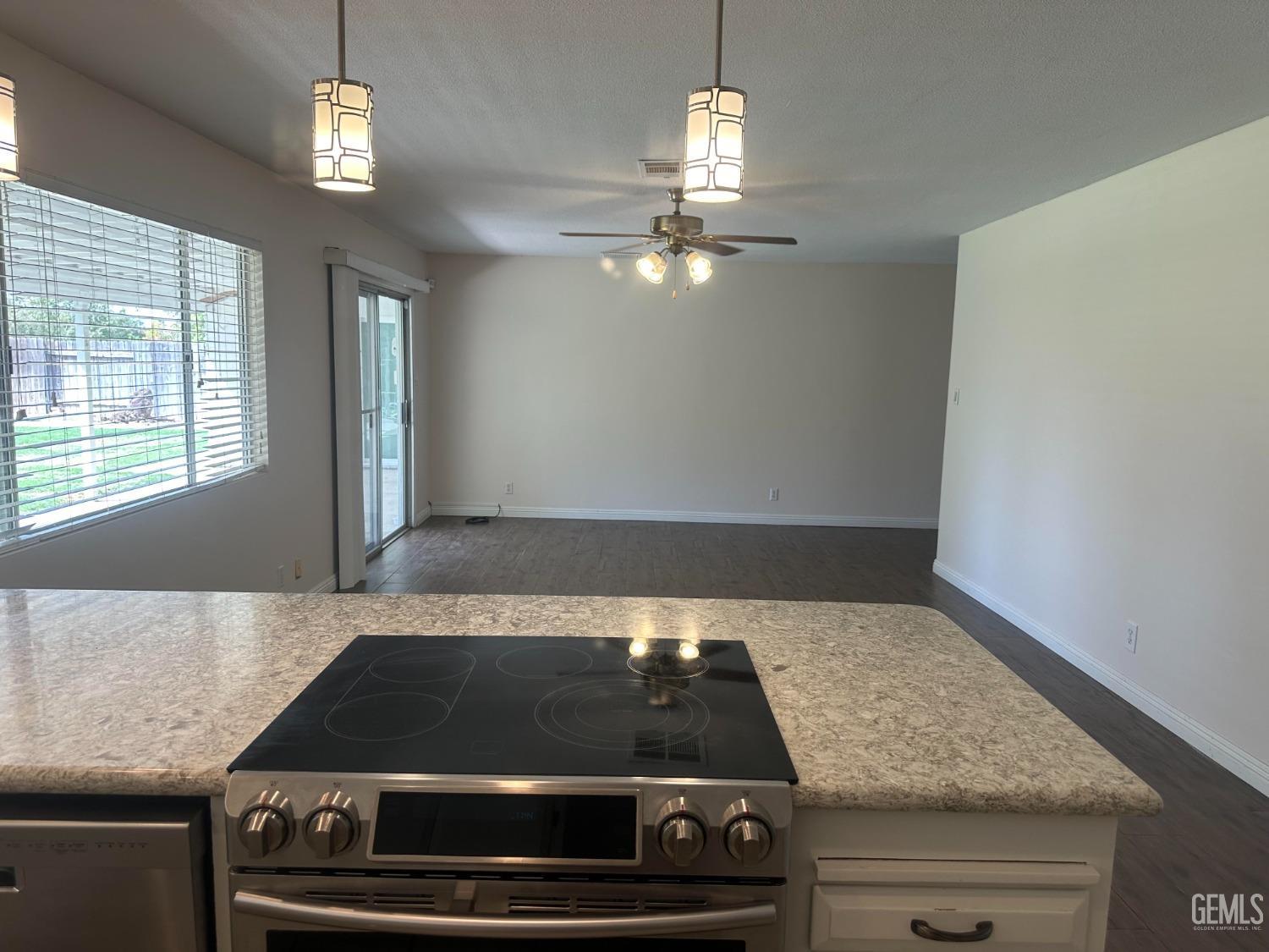 Undisclosed Address Bakersfield, CA 93306 - Photo 19 of 27 a stove top oven sitting inside of a kitchen