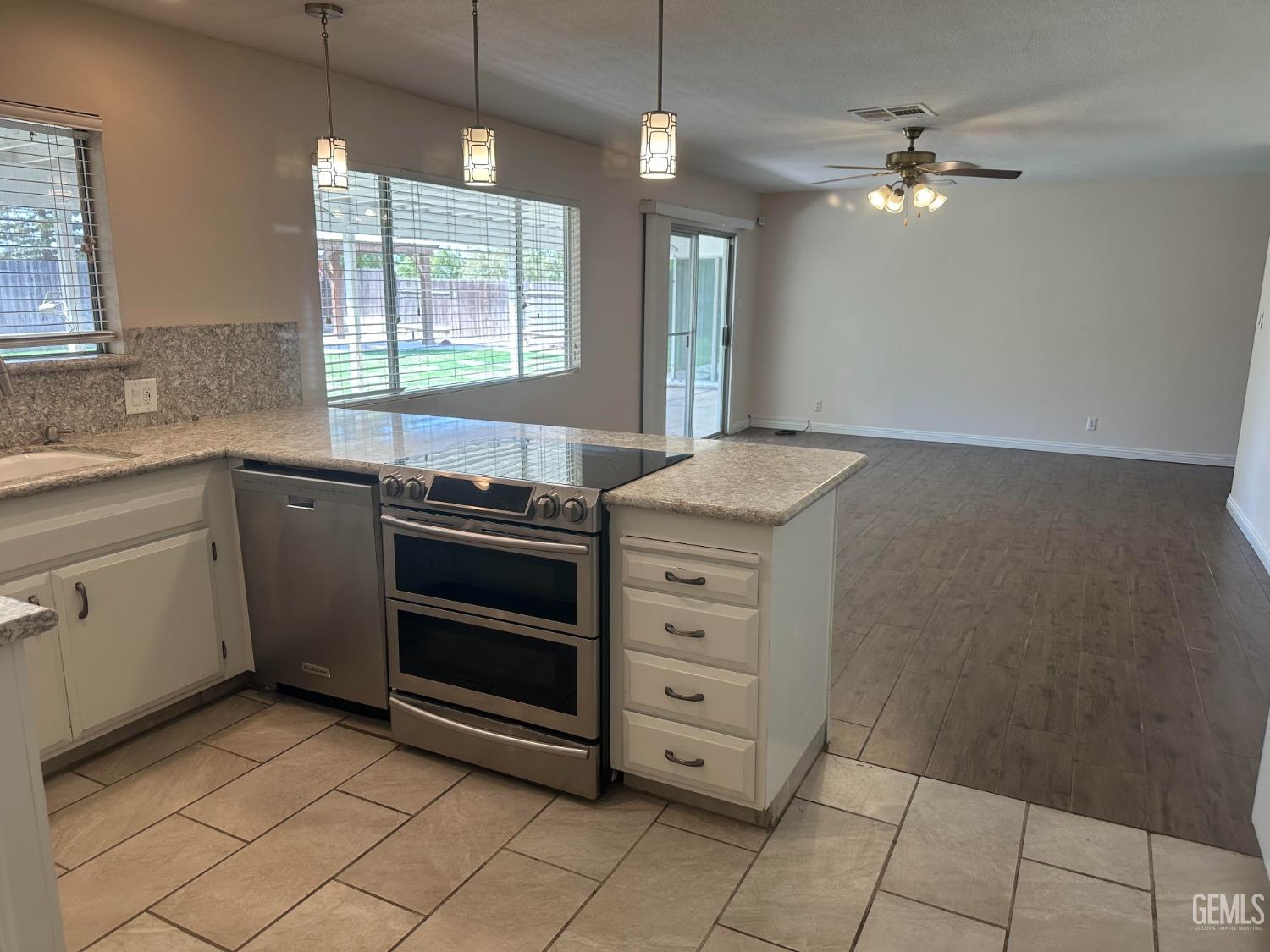 Undisclosed Address Bakersfield, CA 93306 - Photo 20 of 27 a kitchen with a stove and a sink