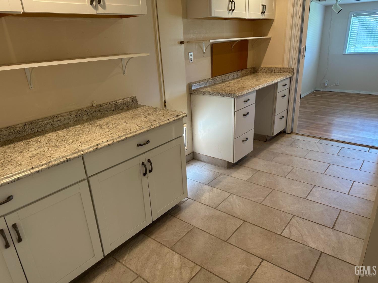 Undisclosed Address Bakersfield, CA 93306 - Photo 21 of 27 a kitchen with stainless steel appliances granite countertop a sink and cabinets