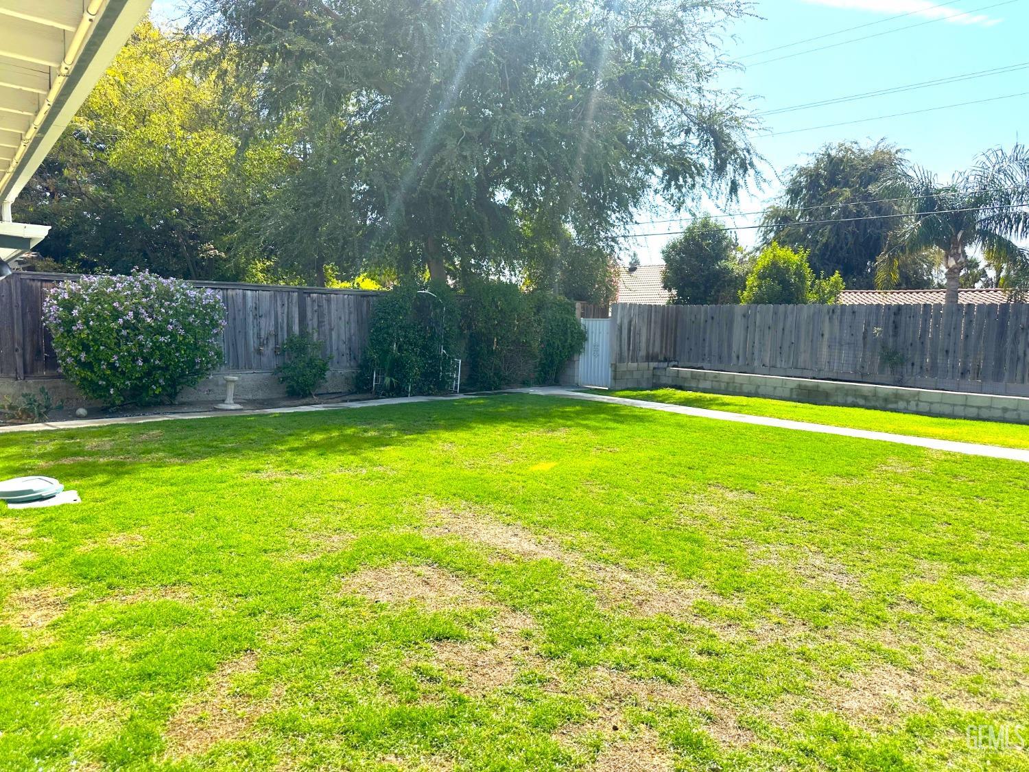 Undisclosed Address Bakersfield, CA 93306 - Photo 27 of 27 a swimming pool with wooden fence