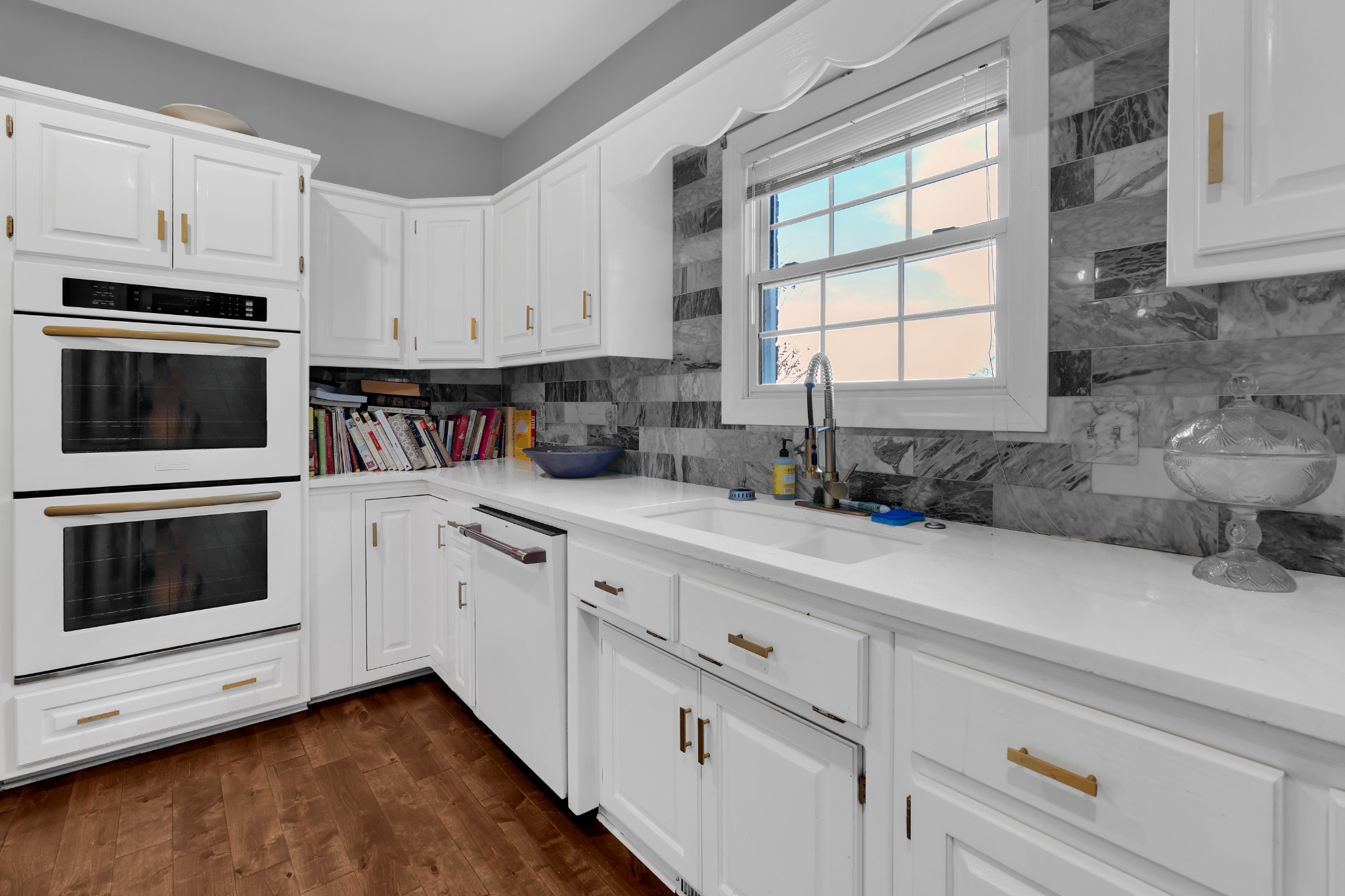 1191 Knights Church Road Decherd, TN 37324 - Photo 19 of 58 a kitchen with granite countertop white cabinets stainless steel appliances and sink