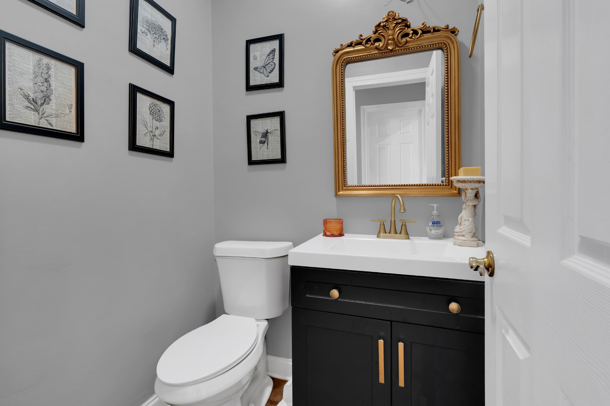 1191 Knights Church Road Decherd, TN 37324 - Photo 20 of 58 a bathroom with a toilet sink vanity and mirror