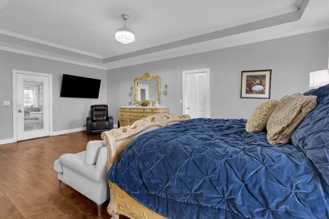 a en suite bathroom with a granite countertop sink and a mirror