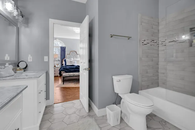 a large white bed in a white room