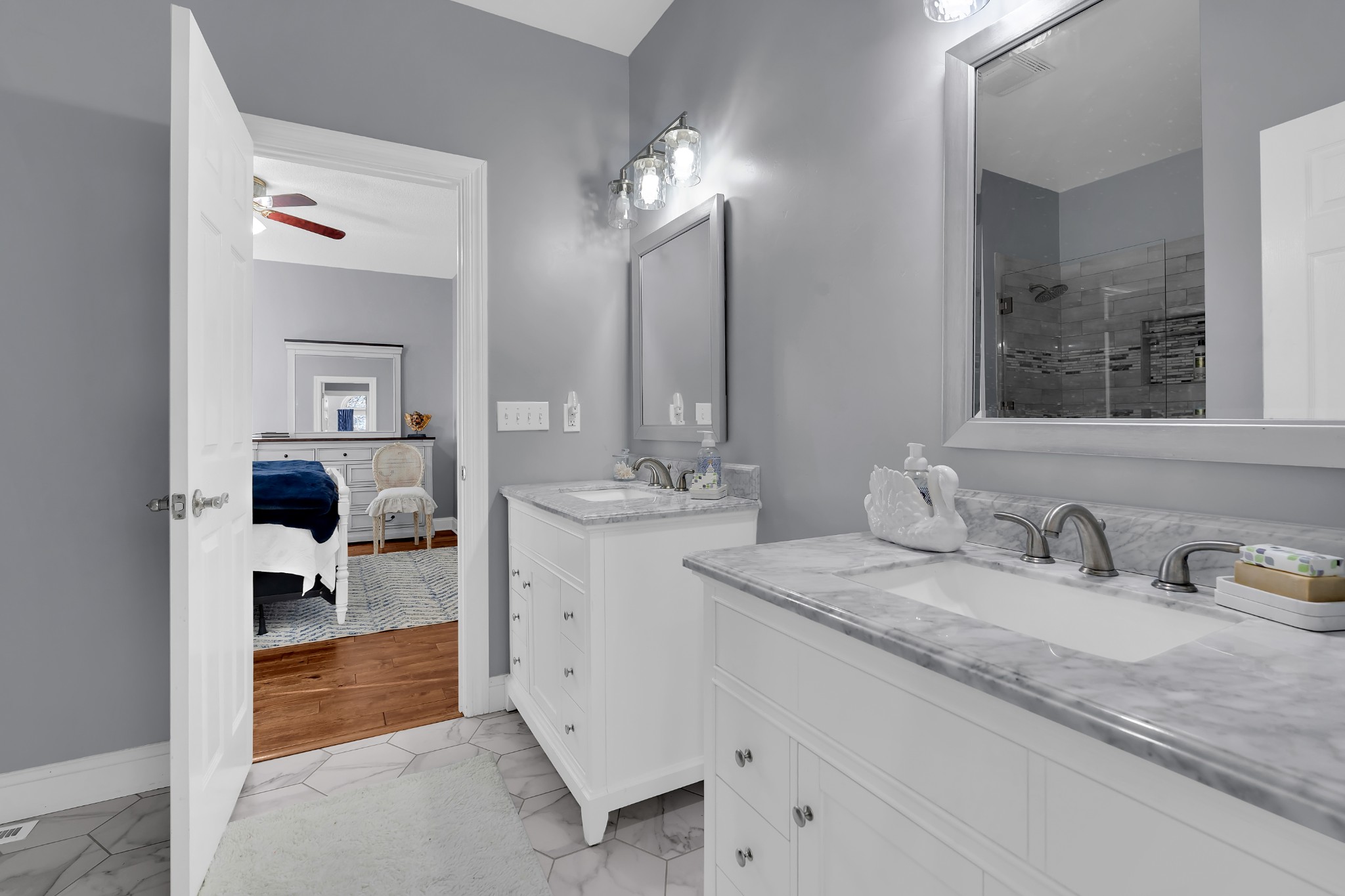 1191 Knights Church Road Decherd, TN 37324 - Photo 27 of 58 a en suite bathroom with a granite countertop sink and a mirror