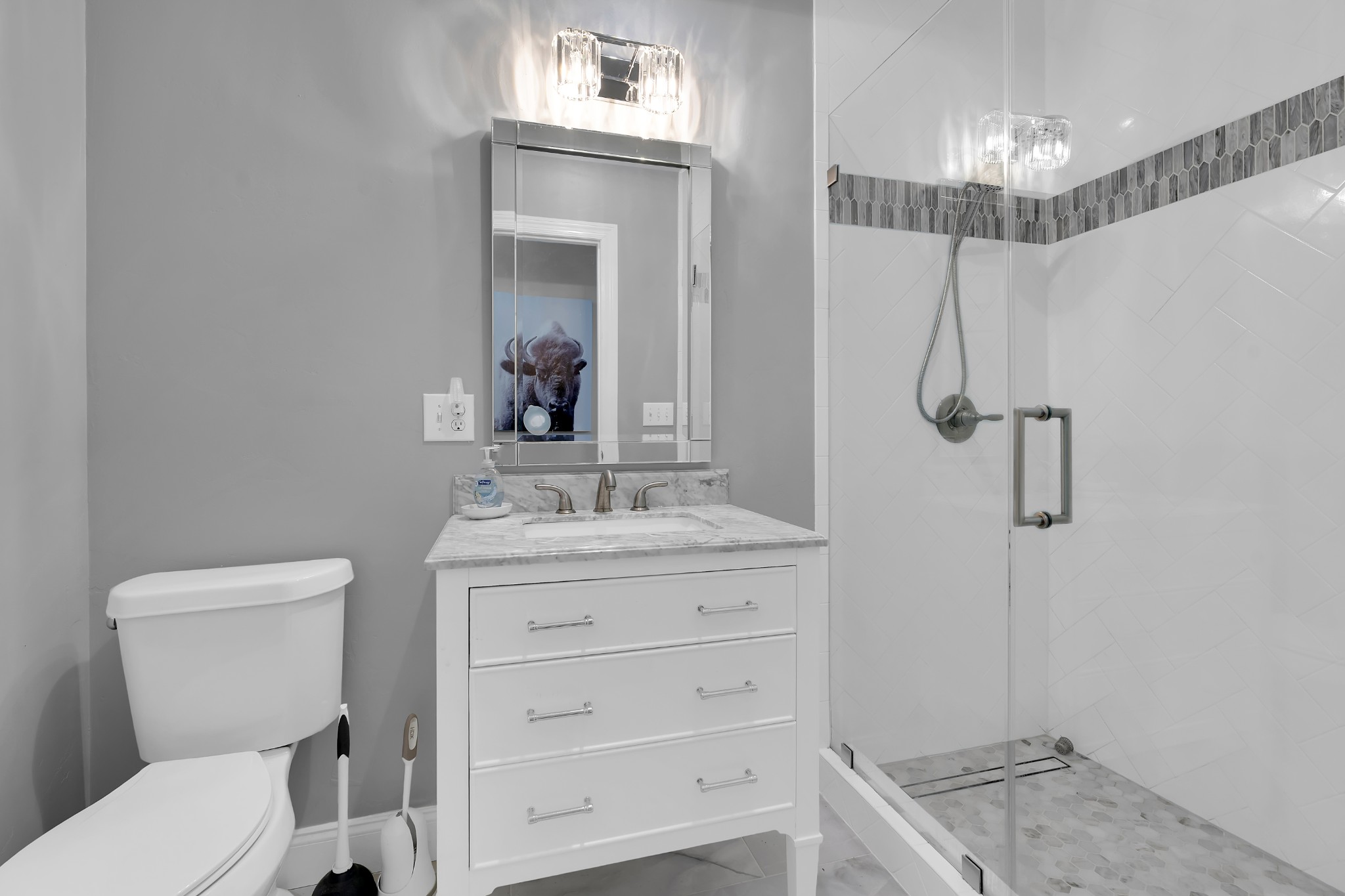 1191 Knights Church Road Decherd, TN 37324 - Photo 29 of 58 a bathroom with a granite countertop sink a toilet a mirror and shower