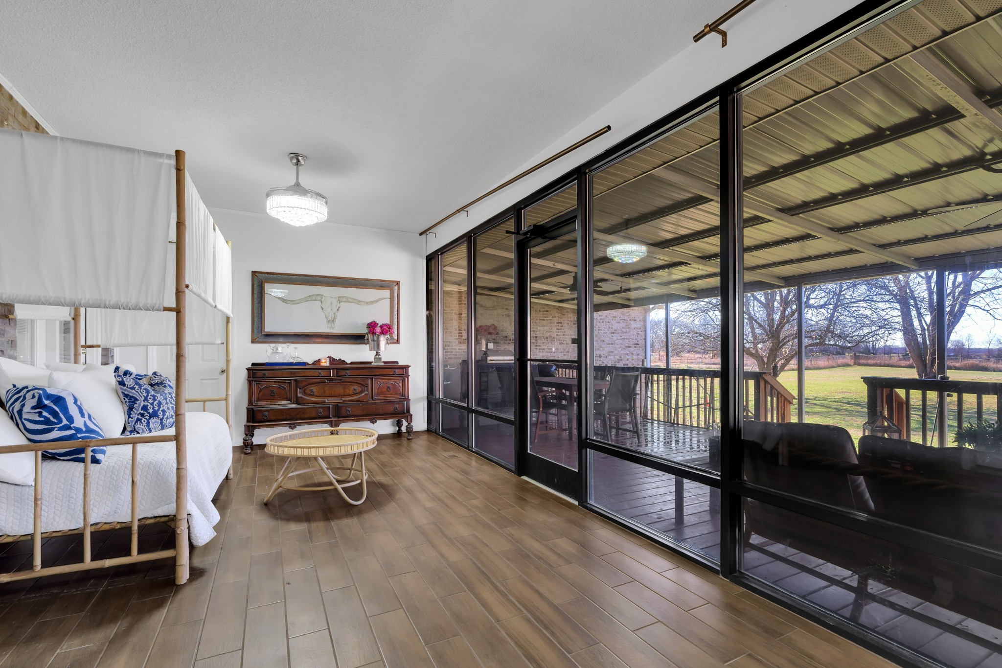 1191 Knights Church Road Decherd, TN 37324 - Photo 38 of 58 a living room with furniture a flat screen tv and a floor to ceiling window